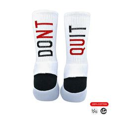 White athletic socks with bold red and black 'DON'T QUIT' text, 100% cotton, ideal for running or training.