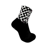 Black athletic sock with white abstract pattern, ideal for running, cycling, tennis, or training