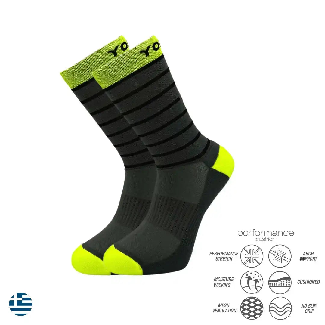 Black and neon green performance athletic socks with cushioned support and moisture-wicking features