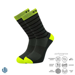 Black and neon green performance athletic socks with cushioned support and moisture-wicking features