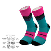 Performance athletic socks with pink, teal, and black stripes, featuring cushioned arch support and moisture-wicking design
