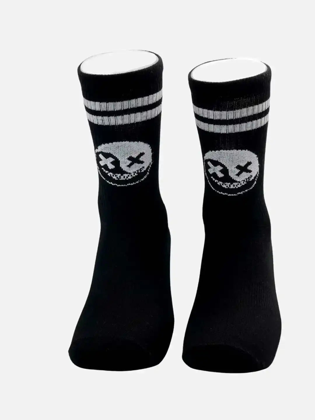 Black athletic socks with white skull graphic and stripes, ideal for running, cycling, or training.
