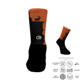 Black and orange performance athletic socks with mountain goat design, featuring cushioned arch support and moisture-wicking fabric