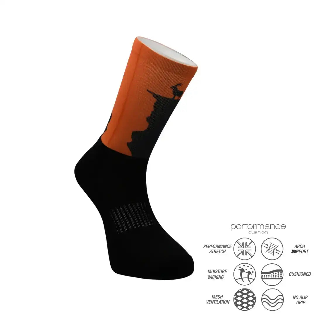 Black and orange athletic sock with Halloween witch design, featuring performance stretch, moisture wicking, and arch support