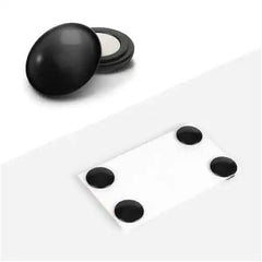 Black magnetic dots and holder on white surface