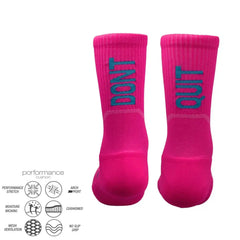Bright pink athletic socks with 'DON'T QUIT' text, featuring performance cushion, arch support, and moisture-wicking design.