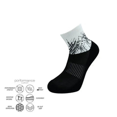 Black and white athletic performance socks with cushioned arch support and moisture-wicking design