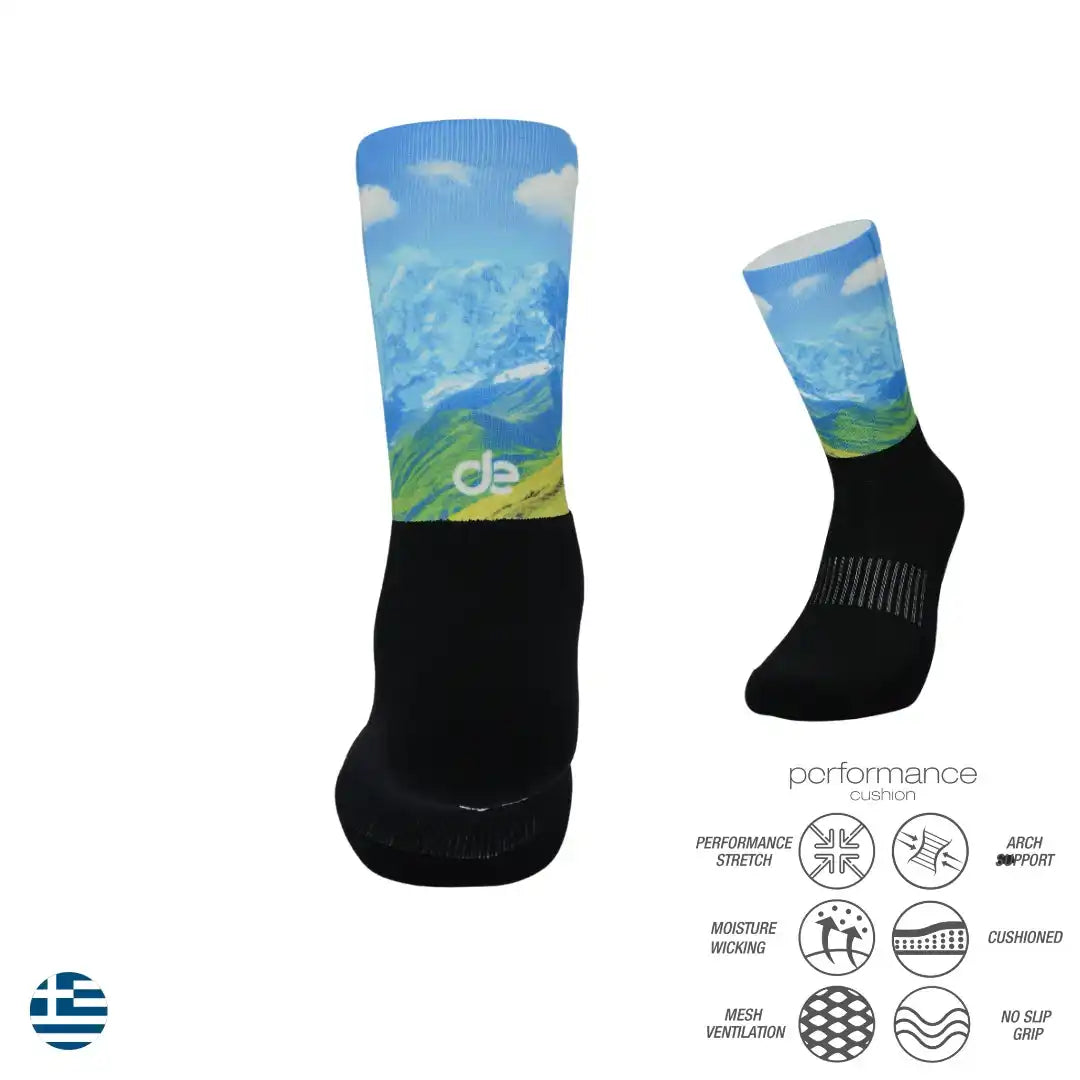 Performance athletic socks with mountain design, moisture-wicking, cushioned, and arch support for running or cycling.